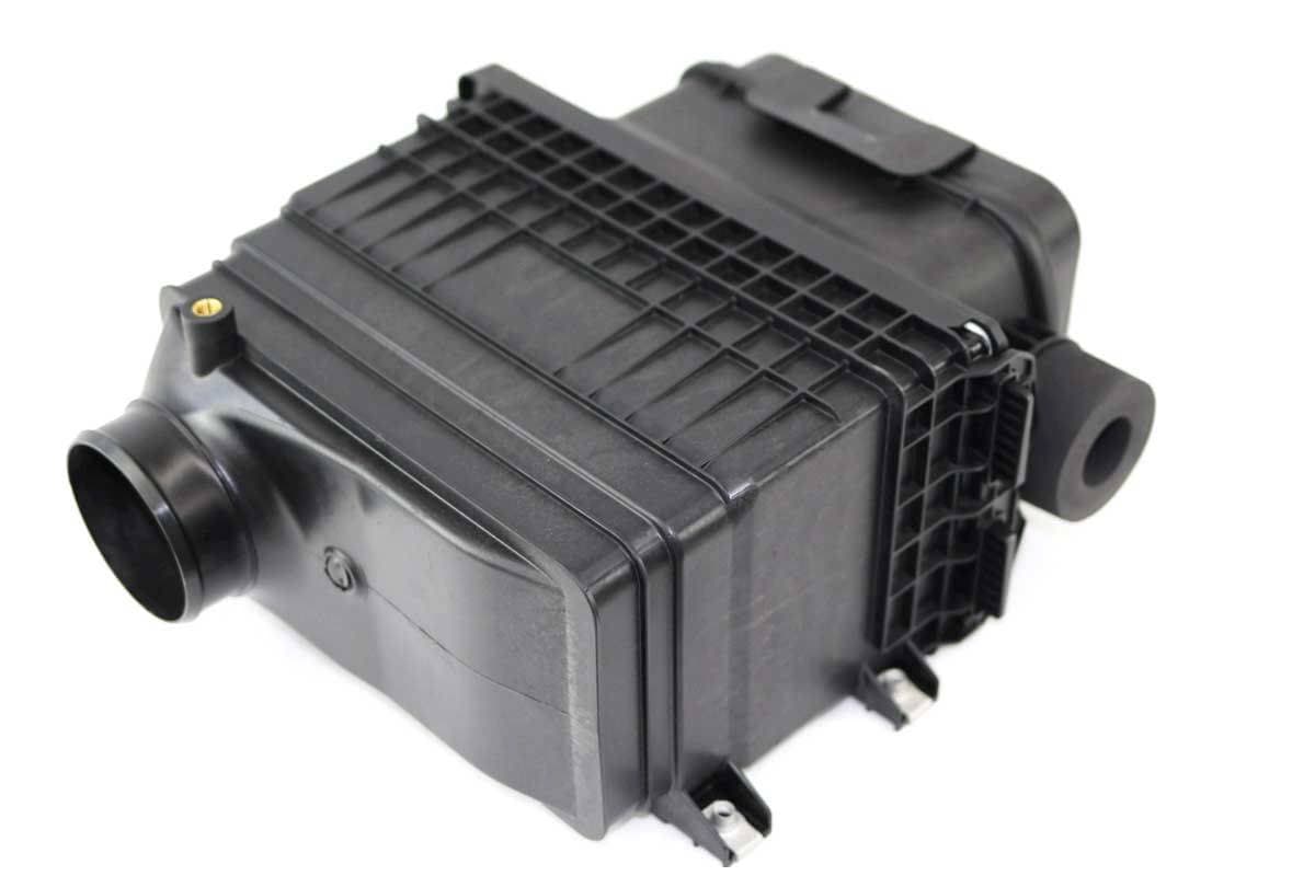 Genuine Bobcat Air Filter Housing, 7286651, holds the inner and outer air filters, showing air intake hose connection.
