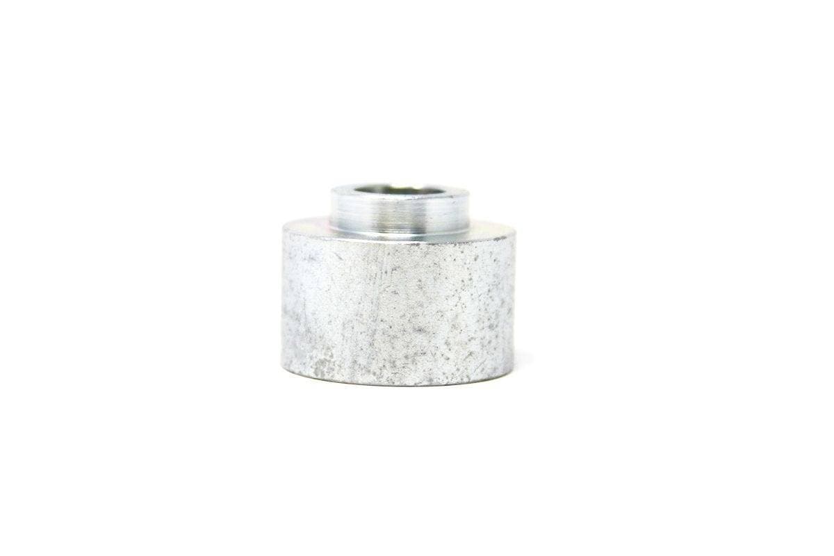 Genuine Bobcat Spacer, 7154460 side view with small part on top. 